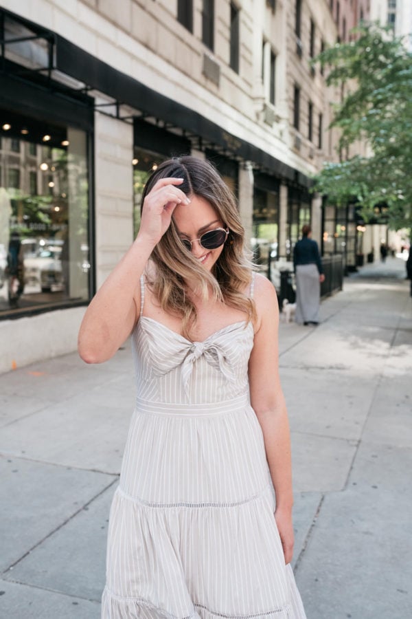 Fashion and beauty blogger Jessica Sturdy wearing a tie-front pinstriped dress.