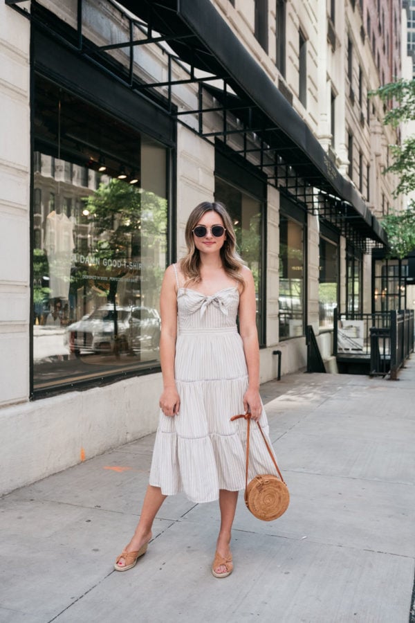 Chicago fashion blogger Jessica Sturdy of Bows & Sequins wearing a tiered midi dress on Delaware St in the Gold Coast.