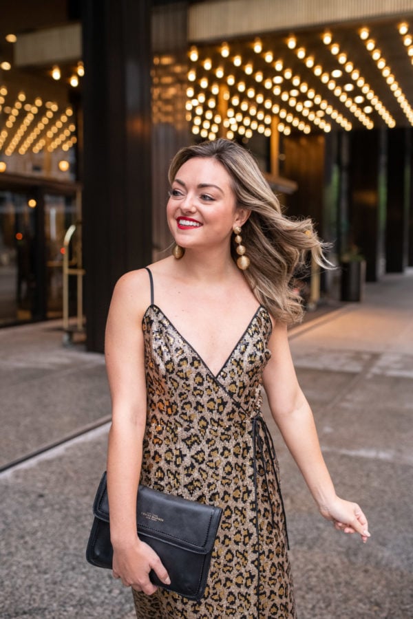 Chicago fashion blogger Jessica Sturdy of Bows & Sequins styling a leopard print dress with gold earrings.