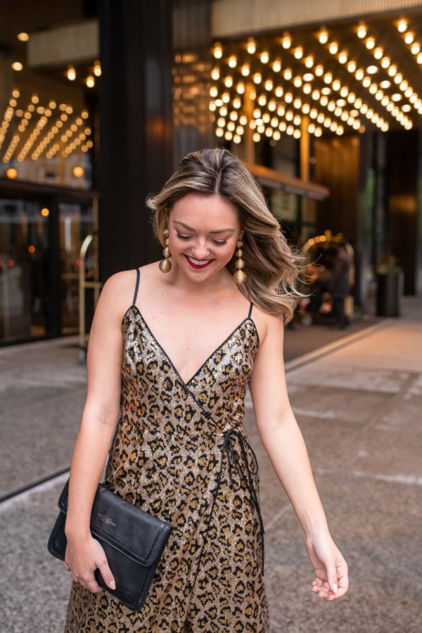Chicago blogger Bows & Sequins wearing a leopard sequin dress in front of The Langham hotel.