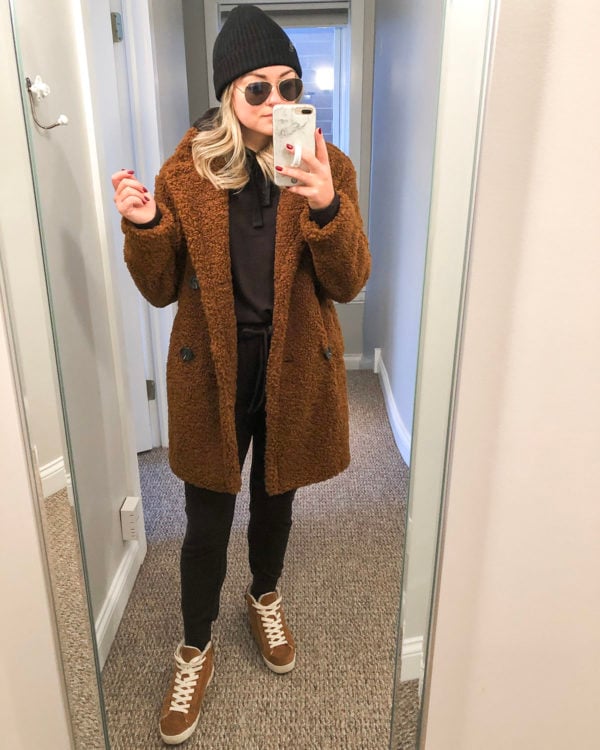 Fashion blogger wearing brown teddy coat with Vineyard Vines joggers and suede sneakers.
