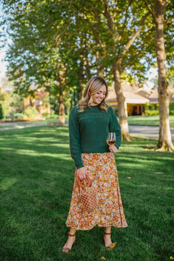 Lifestyle blogger Jessica Sturdy wearing a floral midi skirt at Vintners Inn Resort in Santa Rosa, California.