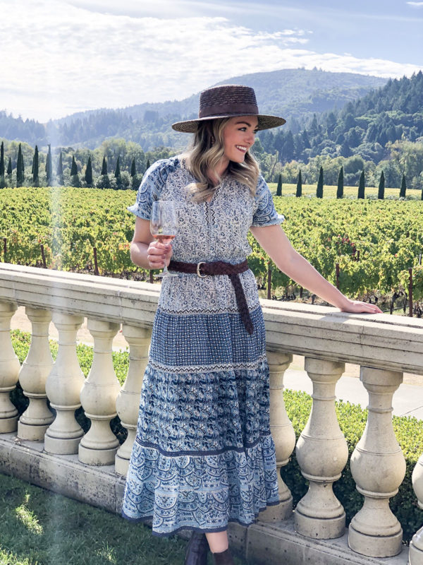 Travel blogger Jessica Sturdy wearing a chic fall outfit at Ferrari-Carano Vineyards in Sonoma County, California.