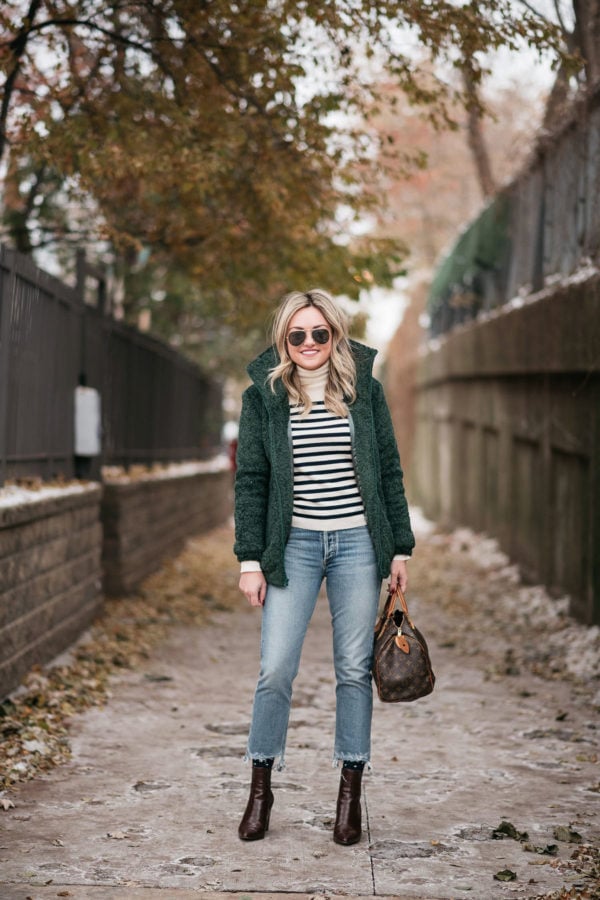 Chicago fashion blogger Jessica Sturdy wearing a Dudley Stephens jacket with jeans and ankle booties.