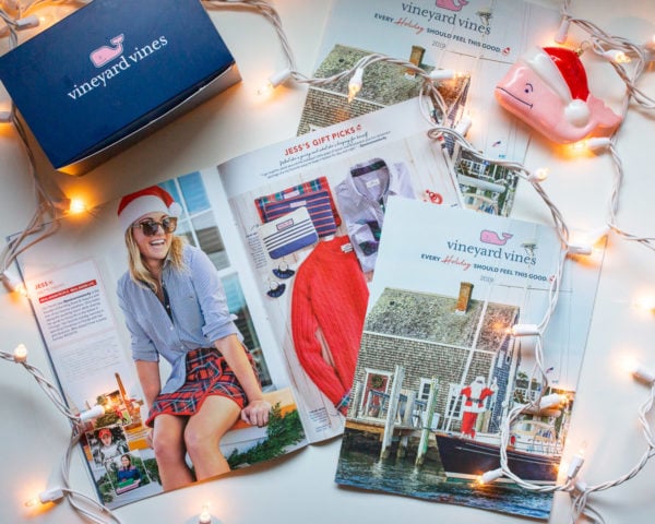 Chicago fashion blogger with an East Coast aesthetic, Jessica Sturdy, of the women's fashion and lifestyle blog Bows & Sequins styling a striped button down shirt with a plaid skirt at Ocean House Rhode Island Veuve Clicquot bar for the Vineyard Vines 2019 Holiday Magazine Shoot. 