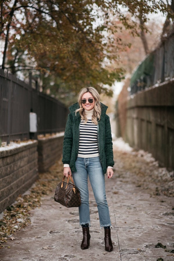 Chicago personal stylist Jessica Sturdy wearing a green bomber jacket with a Louis Vuitton Speedy.