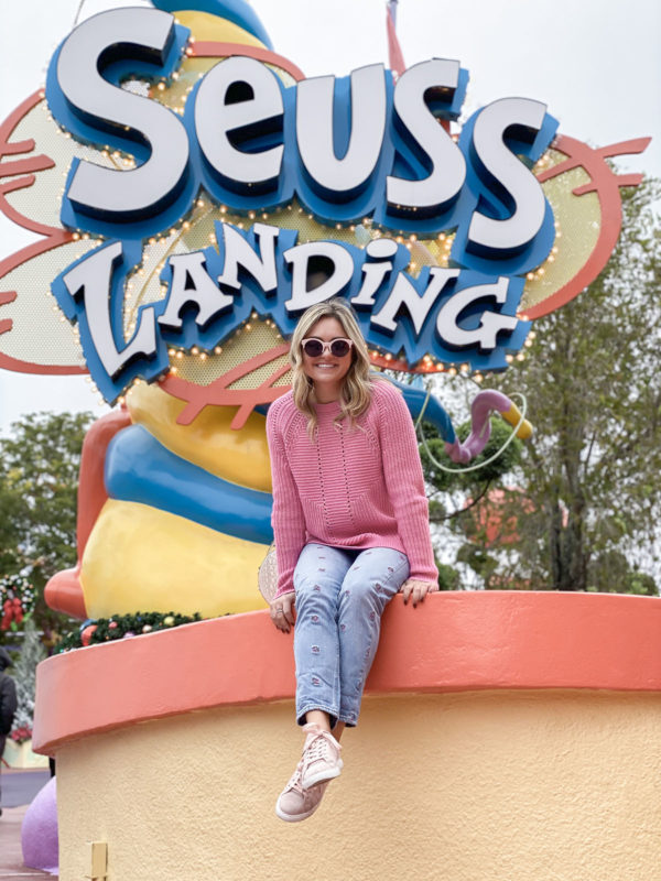Travel blogger Jessica Sturdy of Bows & Sequins at Seuss Landing at Universal Studios in Orlando, Florida.