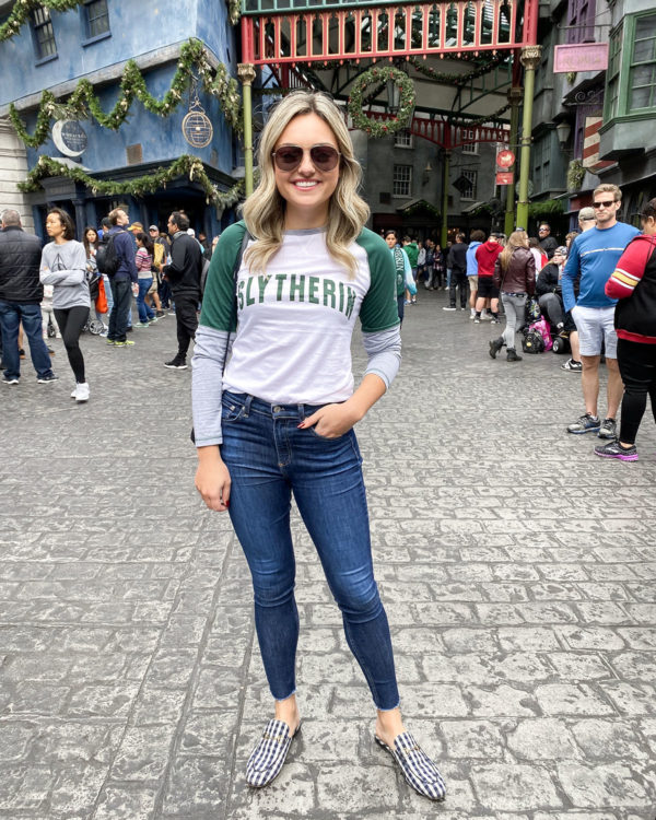Travel blogger Bows & Sequins wearing a Slytherin tee shirt in Diagon Alley.