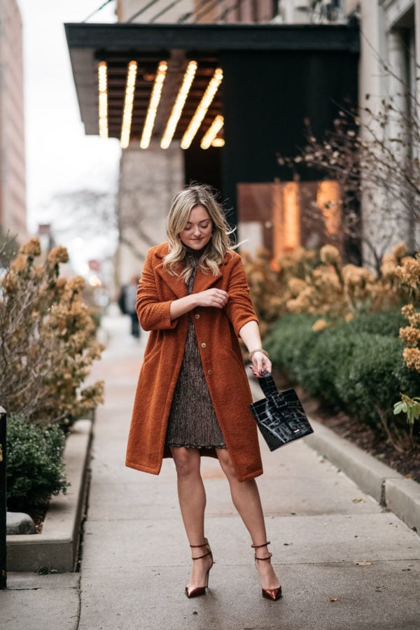 Chicago blogger wearing a teddy coat and party dress.