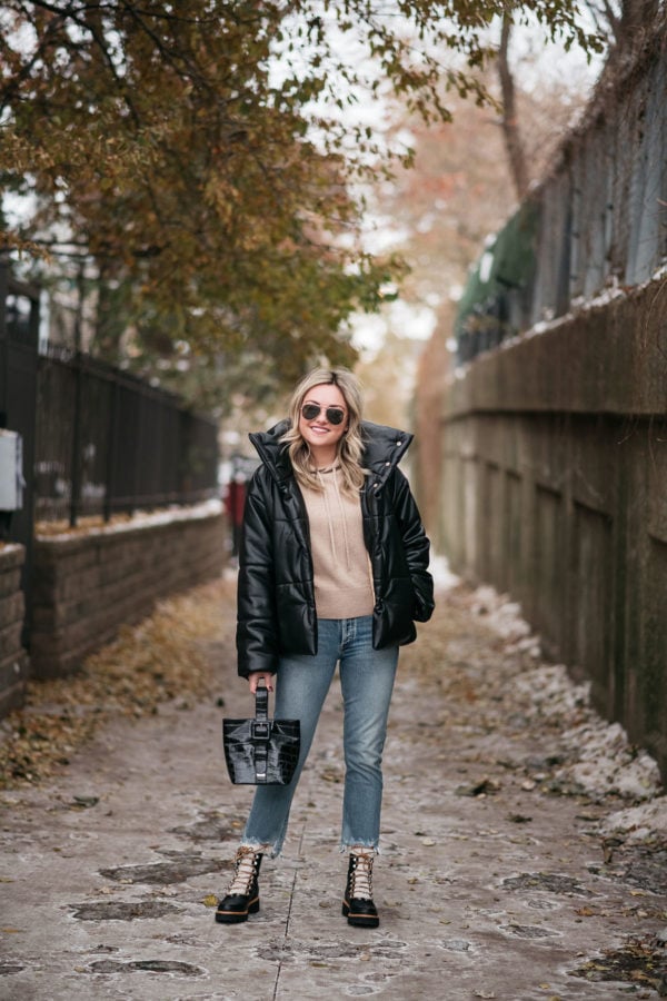 Fashion blogger wearing Nanushka Hide Vegan Leather Puffer Coat with Citizens of Humanity Jeans and Brahmin bag.