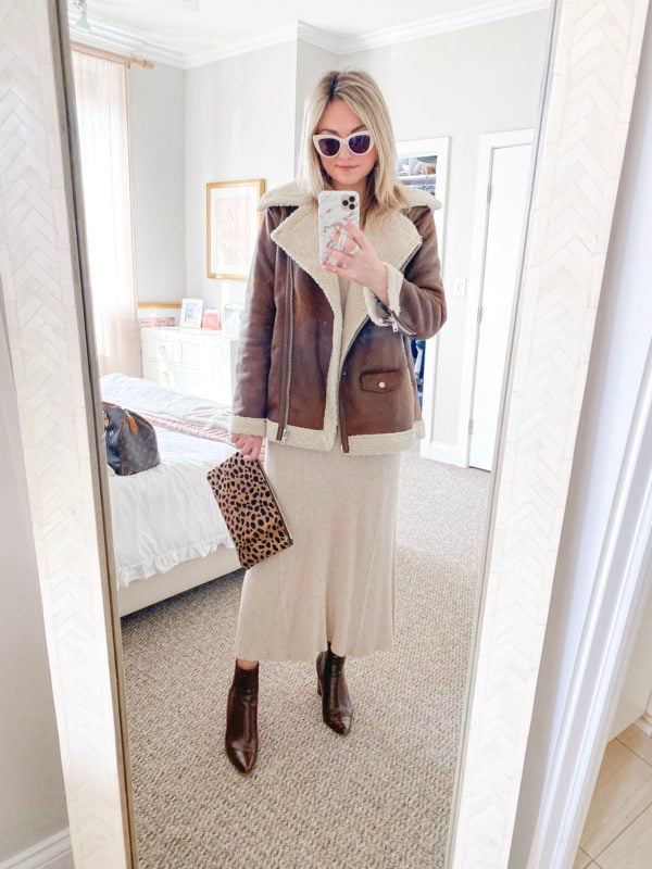Chicago fashion blogger Jessica Sturdy of Bows & Sequins styling an Avec Les Filles moto jacket with a Mango ribbed maxi sweater dress, Clare V leopard clutch, Steve Madden Subtle brown croc booties, and Boden white sunglasses.