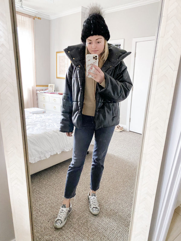 Chicago style blogger wearing a Nanushka vegan leather puffer jacket, a Kyi Kyi beanie, and Golden Goose glitter sneakers.