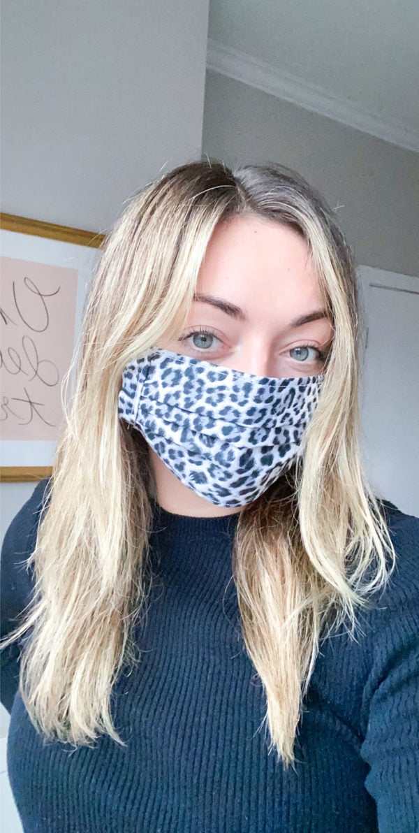 Chicago influencer wearing a black and white leopard face mask.