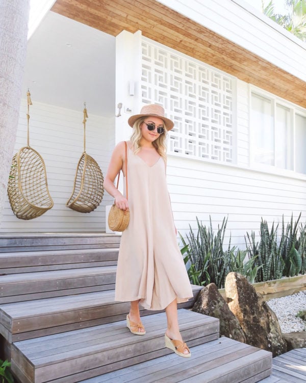 Fashion blogger wearing tan wide leg jumpsuit at Bask & Stow in Byron Bay Australia