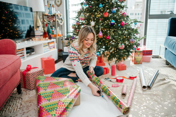 Jessica Sturdy (Chicago blogger behind Bows & Sequins) wrapping colorful gifts.