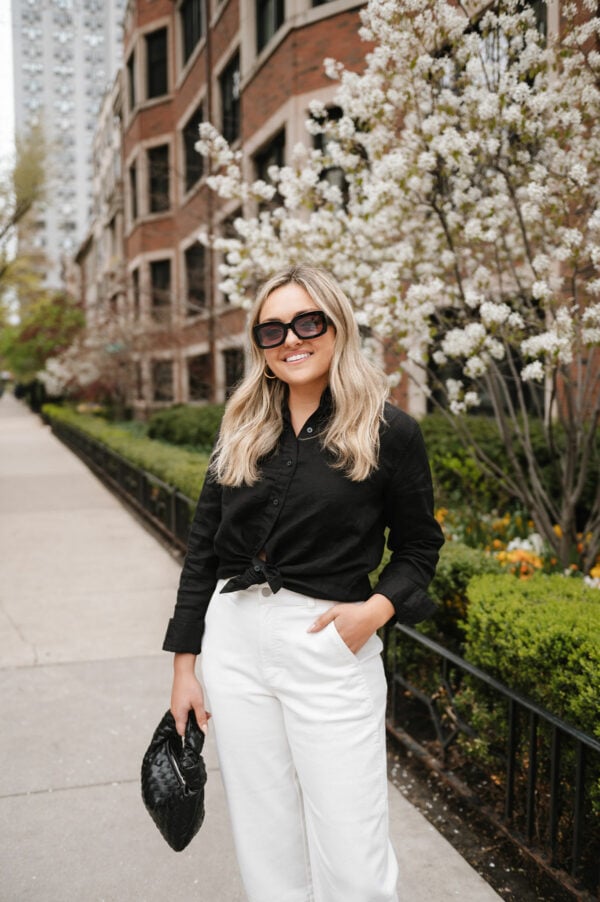 Fashion blogger Jessica Sturdy of Bows & Sequins styling a monochromatic black and white outfit.