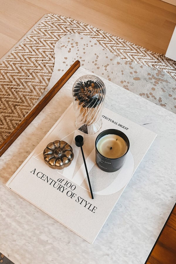 Fashion, home, & lifestyle blogger Jessica Sturdy of Bows & Sequins shares her modern fall decor featuring brass pumpkins