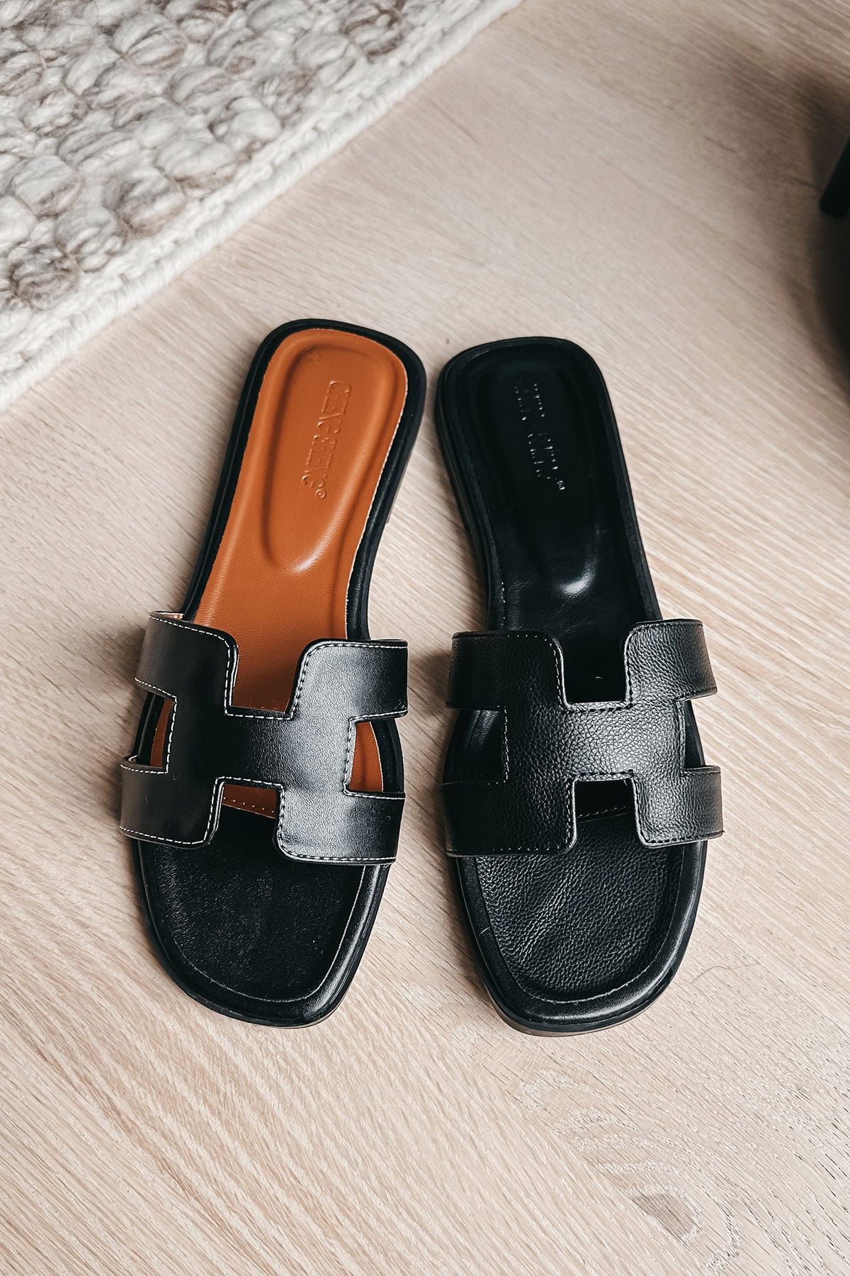 Black Faux Leather 'H' Sandals with White Stitching similar to Hermes Oran