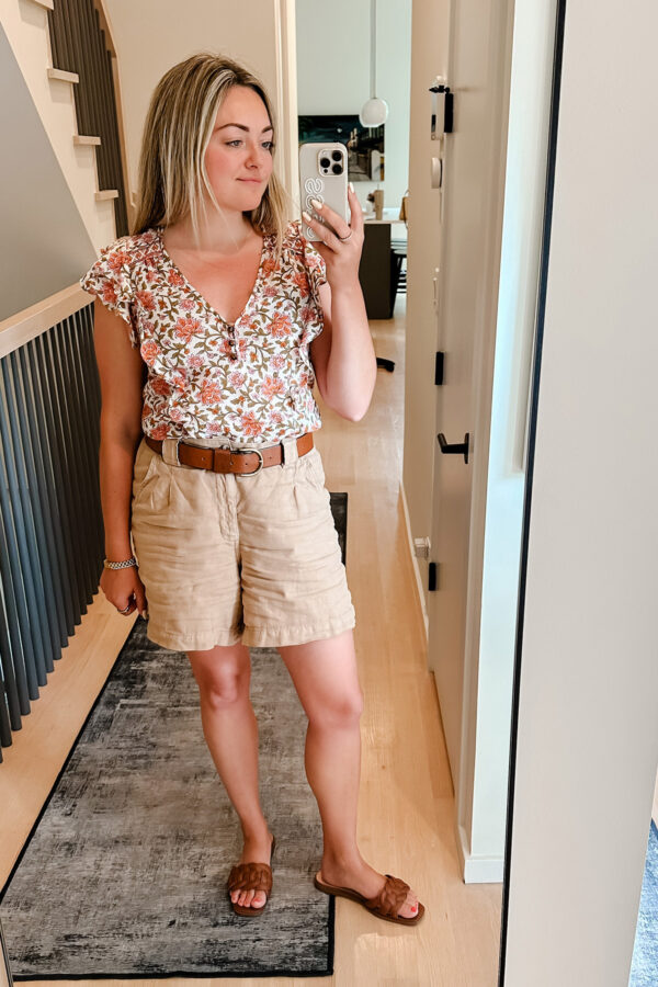 Chicago influencer styling a Veronica Beard top with long linen shorts.