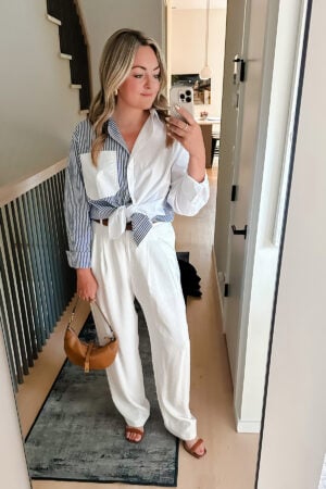 Chicago luxury influencer Jessica Sturdy of Bows & Sequins styling a Katie Kime mixed stripe Oxford shirt with white trousers and a Ralph Lauren leather Polo ID bag for a dinner at RL.