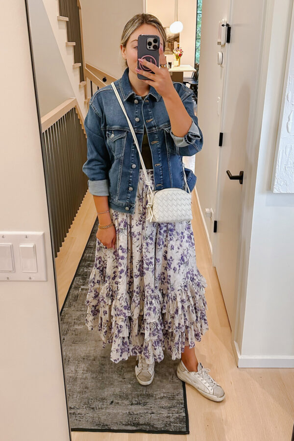Chicago influencer Bows & Sequins styling an oversized denim jacket with a long Ralph Lauren floral maxi skirt.