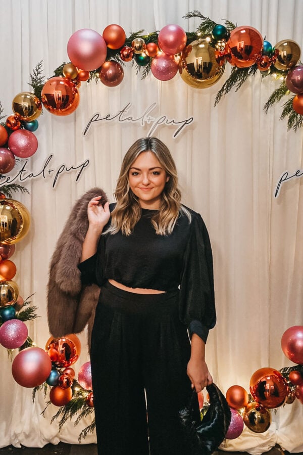 Chicago blogger wearing a satin Petal & Pup set to a holiday party.