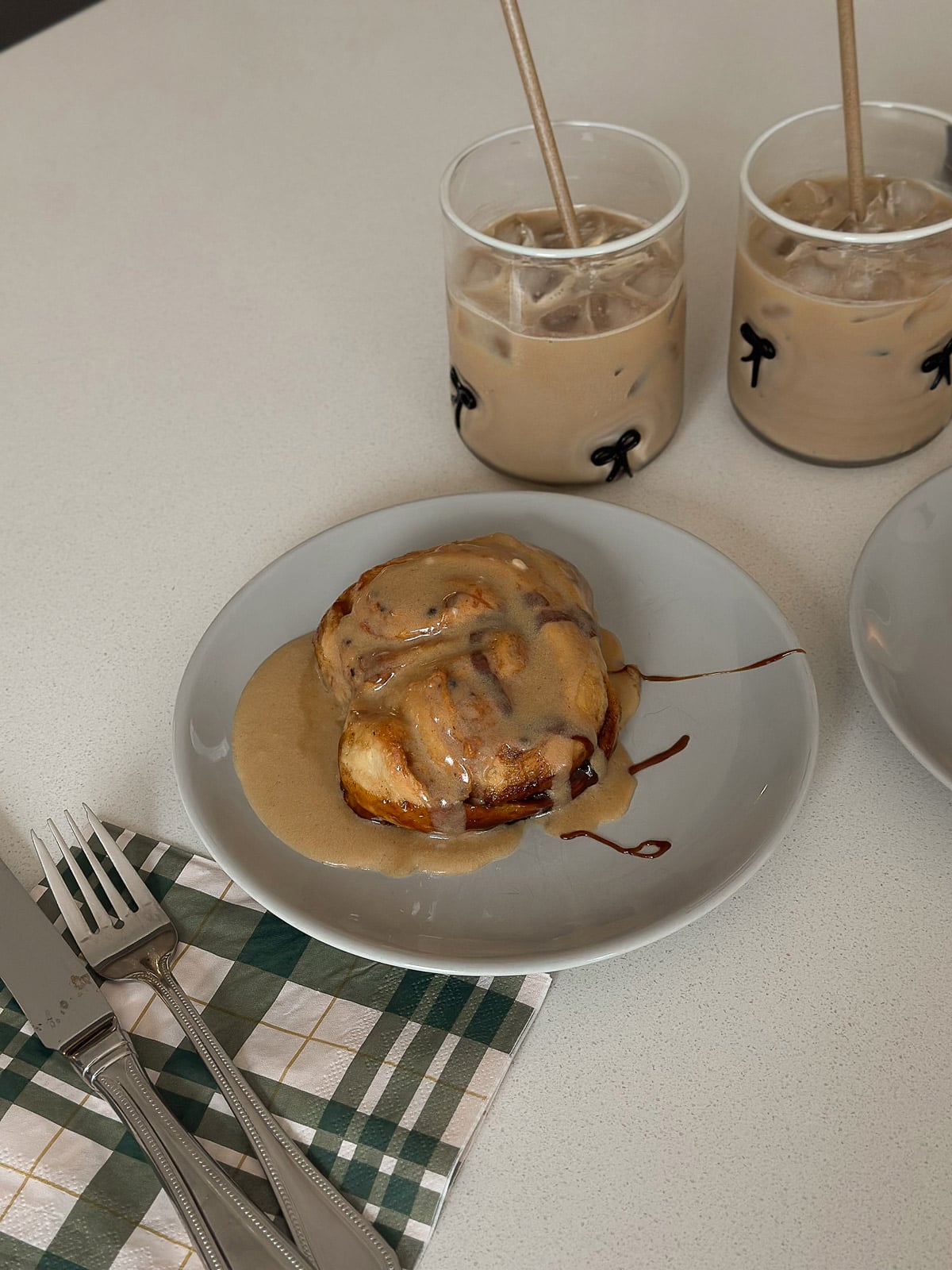 The best cinnamon rolls served warm with iced coffee