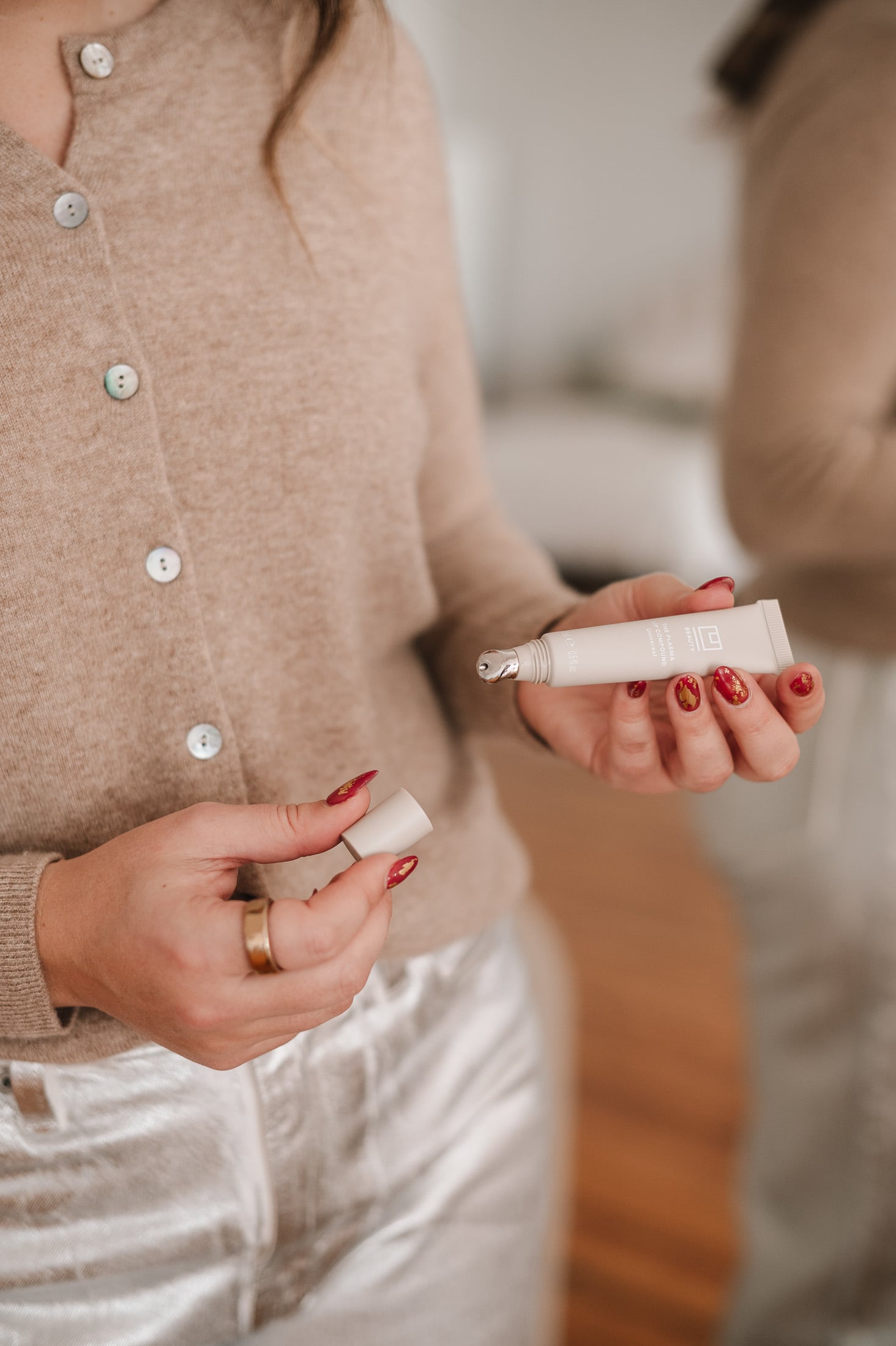 Close-up of metal applicator tip on U Beauty Plasma Lip Compound