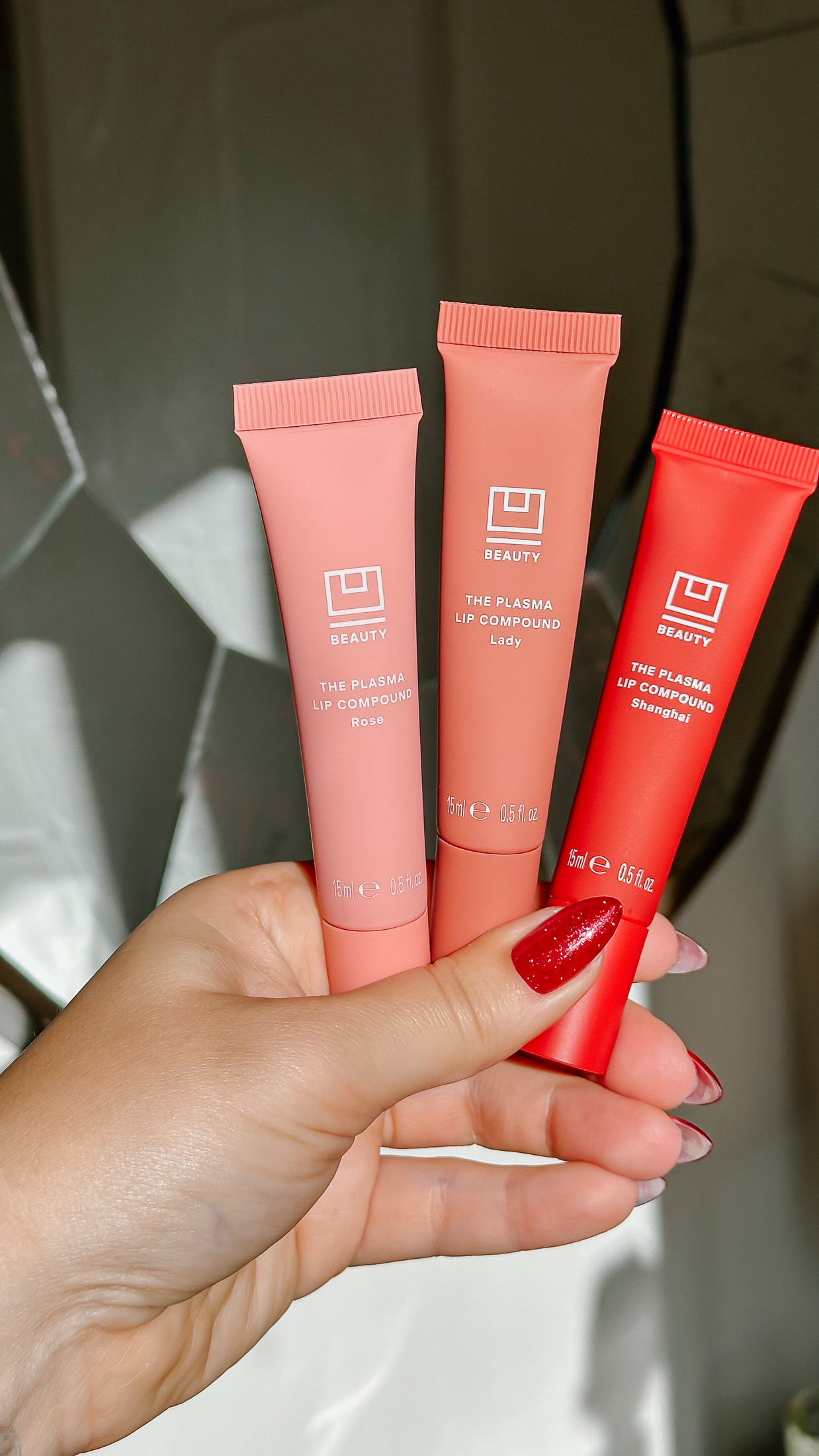 U Beauty Plasma Lip Compound shades held in hand